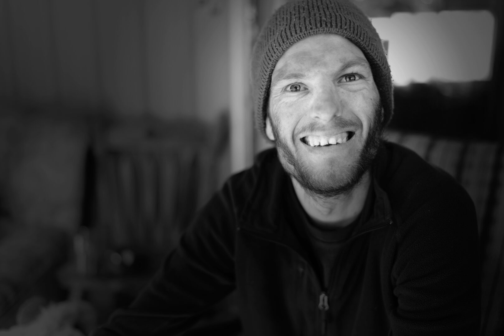 - People with Disability Australia Person wearing a beanie smiling at the camera